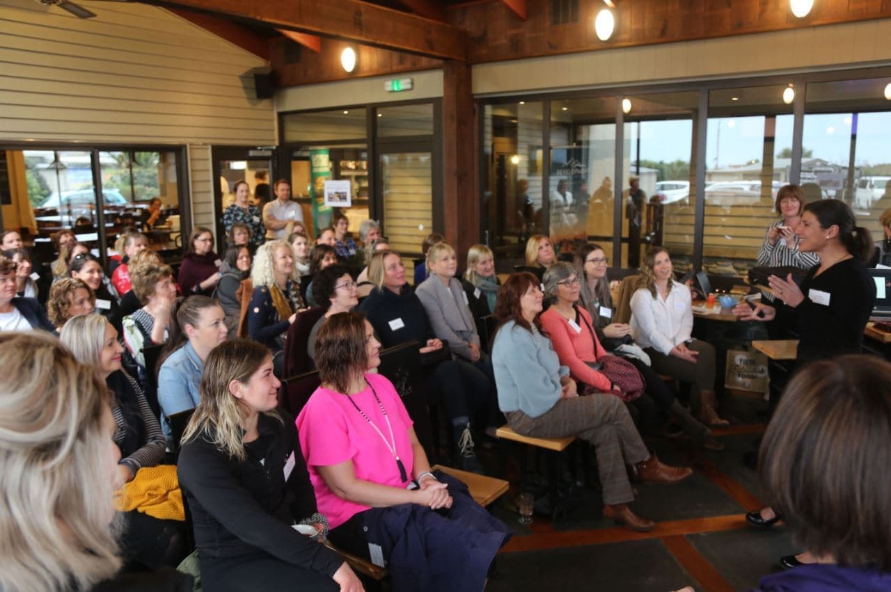 People talking at a networking reception
